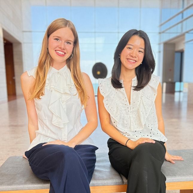 Klara Vinn and Justine Liu sitting next to each other